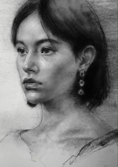 a pencil drawing of a woman's face with earrings on her head, looking off to the side