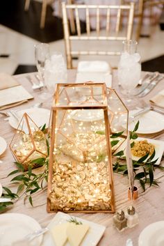 the table is set with plates and silverware