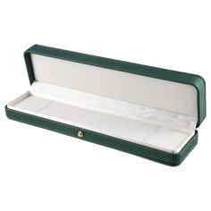 an open green box with white linings on the lid and bottom, sitting on a white background