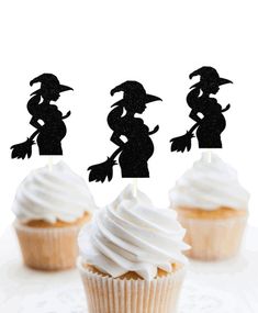 three cupcakes with white frosting and black silhouettes