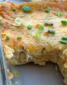 a casserole with cheese and green onions on it is ready to be eaten