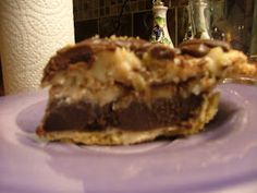 a piece of cake sitting on top of a purple plate