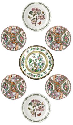 six plates with floral designs on them are arranged in the shape of a flower arrangement