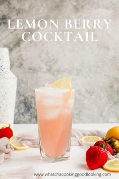 a lemon berry cocktail is garnished with strawberries and lemons