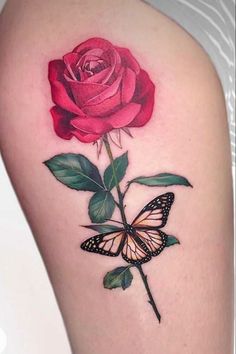 a rose with a butterfly on it and a pink rose in the middle is shown