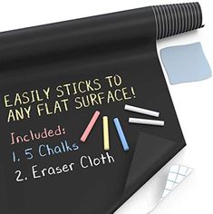 a blackboard with chalk and markers on it next to a white mouse pad that says, easily sticks to any flat surface included