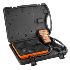 an orange and black case with a digital meter in the inside, on a white background