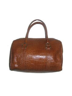 "Vintage Vivace Tan Brown Gold Embossed Reptile Finish Leather Fabric Lined Double Handle Zippered Duffle Handbag     Measurements Height: 9\" Length: 11\"   Width: 5\"     Handbag in very good used pre-owned vintage condition        Please contact ANVINTRO with any questions regarding this item" Classic Brown Bag With Crocodile Pattern, Classic Travel Satchel With Crocodile Pattern, Travel Satchel In Textured Tan Leather, Travel Tan Textured Leather Satchel, Classic Crocodile Pattern Satchel, Cognac Leather Bag With Crocodile Pattern, Leather Bags With Crocodile Pattern In Cognac, Vintage Travel Bags With Crocodile Pattern, Vintage Business Bag With Crocodile Pattern