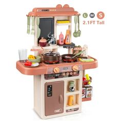 the toy kitchen is set up to be used as a child's play food set