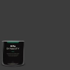 a can of paint on a green background with the words dymasty written in white