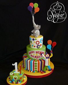 a birthday cake with an elephant on top