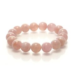 Madagascar Rose Quartz Stretch Bracelet 12mm Size Approx. 6 3/4" Rose Quartz is the pink variety of Quartz. Its colors range from a pastel pink to a rose pink hue, including orange and violet pink tones, which are believed to be caused by trace amounts of aluminum, phosphorous and manganese. While Rose Quartz can often be very opaque with just a hint of pink, Madagascar Rose Quartz is noted for its fine translucency (soft radiating inner glow); beautiful classic ‘rose’ hues with an almost lumine Pink Rose Quartz Round Stretch Bracelet, Pink Rose Quartz Stretch Bracelet, Pink Rose Quartz Round Beaded Bracelets, Pink Rose Quartz Round Bracelet, Pink Bracelets With 8mm Round Beads, Pink Rose Quartz Stretch Bracelet With 8mm Beads, Elegant Pink Bracelets With 8mm Beads, Orange And Violet, Inner Glow