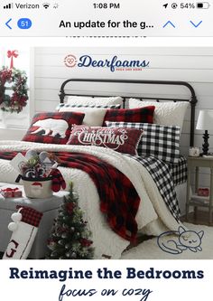 a christmas themed bedroom with red and black plaid bedding, white pillows and decorations