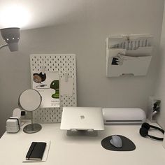 an apple computer sitting on top of a white desk