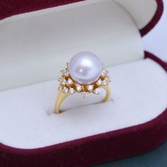 "Splash Ring is the newest addition to our collection of fine quality silver pearl jewelry- perfect for weddings and engagements parties  Specification: Material - 925 silver Stone -  Freshwater Pearl Pearl Color - White , Purple Metal Color - Silver  Pearl size - 11-12 mm Made by Notteluna      Custom made to order NEW STORE OPENING 8 WEEKS EXCLUSIVE OFFER. LIFETIME WARRANTY  Time and time again, we come across products that break the next day after you buy them.  That's not going to happen for you at our store, Mozaiku.  You can buy Mozaiku with peace of mind knowing that we will fix anything that happens to our jewels.  We are so confident nothing will happen that we can offer a lifetime warranty on all our products. UNLIMITED AMOUNT OF GIFTING CUSTOMIZATIONS  Depending on the occasion Silver Pearl Jewelry, Store Opening, Bridal Pearls, Pearl Color, Pearl Size, Silver Pearls, White Ring, Pearl Ring, Pearl Jewelry