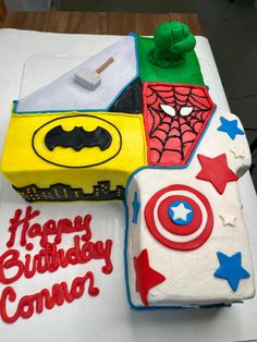 a birthday cake made to look like superheros