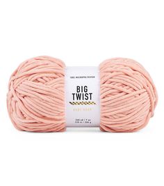 a ball of pink yarn with the words big twist written on it in black and white