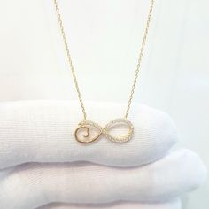 -The Infinity Forever Love design with zirconia stones women jewelry pendant necklace is made with high-quality 14K real solid gold. - This dainty, cute, charm, delicate and trendy pendant necklace has been artfully designed for timeless yet modern millennial fashion. - This 14K real solid gold pendant comes with a beautiful matching 14K gold chain. - You receive the pendant in a beautiful and free gift box. - Free shipping (Arrive within 4 business days to USA and Canada ( 1 day for production Gold Diamond Infinity Necklace, Infinity Locket Gold, Infinity Jewelry With Diamond Accents For Gift, Gold Pendent Simple For Girls, Gold Infinity Necklaces With Diamond Accents, Gold Infinity Necklace With Diamond Accents, Gold Infinity Necklace For Gift, Infinity Pendant Gold, Gold Infinity Necklace For Birthday