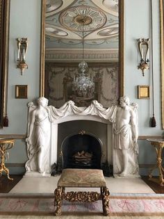 an ornate fireplace in the middle of a room