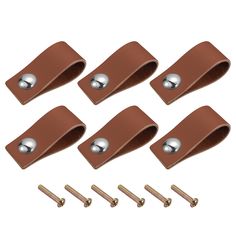 six pieces of brown leather with screws and nuts on the top one is open