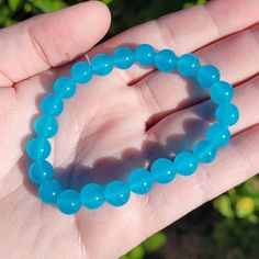 8mm Blue Chalcedony Round Beaded Stretch Bracelet (dyed). 📸 These photos were taken with natural daylight to show the most honest look and coloring since everyone's indoor lighting is widely different.  ⭐ 5-Star US Seller with emphasis on customer service   🌐 Go to www.facebook.com/kellys.jewls.1 to see all of my items organized by photo albums on my public Facebook profile. While you're there, add Kellys Jewls as a friend to be the first to see my sales, live feeds and new products.  ITEMS FO Bismuth Jewelry, Agate Crystal, Crystal Sphere, Blue Chalcedony, Crystal Gifts, Beaded Stretch Bracelet, Blue Crystals, Stretch Bracelets, Round Beads