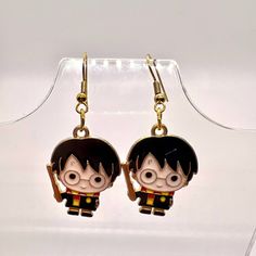 a pair of harry potter earrings on display