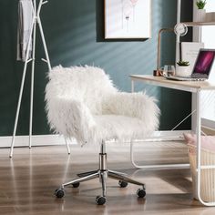 a white chair sitting on top of a hard wood floor next to a wooden desk