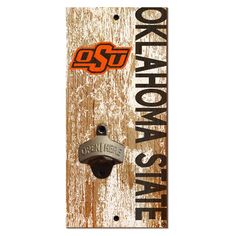 a skateboard with the words oklahoma state on it and an orange, black and white logo