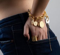 "♦ A beautiful gold bracelet is designed in two layers of link chains and decorated with 8 different coins. The bracelet is made of gold plated brass and 2 coins from silver-plated brass. The bracelet is full of presence and style. ( width coin between 0.39\" (1cm) 0.98\" (2.5cm ) The length ranges from 6.3\"(16 cm) to 8.2\"(21 cm). If you want a different length, please update me when you place your order. width chain: 0.79\"( 2cm) ♦ This piece of jewelry is perfect as a gift for yourself, for Gold-tone Coin Shaped Metal Jewelry, Brass Chain Charm Bracelet Gift, Brass Charm Bracelet As Gift, Metal Coin-shaped Jewelry With Charms, Gold Plated Chain Bracelet With Charms, Gold Brass Charm Bracelet With Chain, Elegant Bracelets With Coin Pendant For Gift, Elegant Bracelet With Coin Pendant As Gift, Elegant Coin Pendant Bracelet As Gift