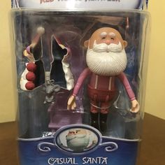 a toy figurine in the shape of a santa clause with two other toys