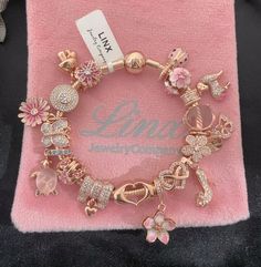 Elegant Rose Gold Bracelets With Removable Charms, Rose Gold Snake Chain Charms As Gift, Rose Gold Snake Chain Jewelry With Charms, Elegant Rose Gold Jewelry With Removable Charms, Rose Gold Snake Chain Bracelet, Elegant Pink Charms With Removable Details, Elegant Rose Gold Charms, Elegant Pink Snake Chain Bracelet, Pink Charm Bracelet