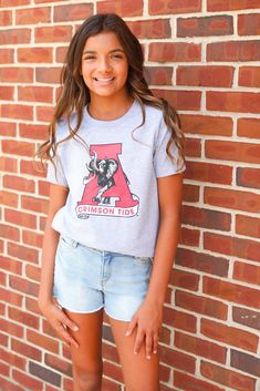 Youth t-shirt with vintage Alabama logo Unisex Model is size 10-12 Spring School Spirit Streetwear T-shirt, Spring School Spirit T-shirt For Streetwear, Spring School Spirit T-shirt With Crew Neck, Spring Crew Neck T-shirt With School Spirit, Spring Streetwear T-shirt With School Spirit Style, Spring Fan Merchandise T-shirt, Collegiate Summer T-shirt, Collegiate Pre-shrunk T-shirt For Summer, Spring Crew Neck Fan Apparel T-shirt