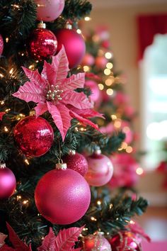 a christmas tree decorated with pink and red ornaments