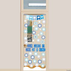 the door is decorated with snowflakes and decorations