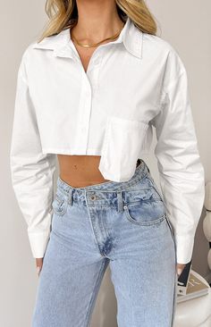 * White Long Sleeve Crop 
 * 
 
 * HOW TO STYLE: 
 * This crop top () is a must have in your wardrobe. Style with pants () and heels () for a more sophisticated look or jeans and sneakers for a casual fit. 
 * 
 
 * FEATURES: 
 * Lightweight 
 * Cropped length 
 * Long sleeve 
 * Collared 
 * Button down 
 * No stretch 
 * Over hanging pocket Style With Pants, Prom Midi Dress, 60's Dress, Summer Playsuit, Sweater Crop, White Button Up, Strapless Tops, Crop Top Sweater, Wardrobe Style