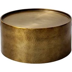 a round brass tray with holes on it