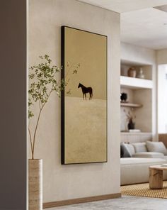 a painting hanging on the wall in a living room