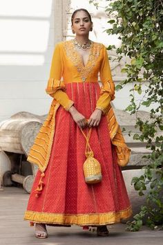 Haldi anarkali with woven motifs and embroidered detail. Paired with churidar and tassel dupatta.
Components: 3
Fabric: Handwoven Banarasi Cotton, Raw silk, Georgette
Neckline: V neck
Sleeve Length: Full
Color: Yellow
Embroidered
Note: Bag shown in the image is not for sale - Aza Fashions Haldi Anarkali, V Neck Anarkali, Neeta Lulla, Cotton Anarkali, Coral Fabric, Tarun Tahiliani, Churidar, Designer Gowns, Indian Design