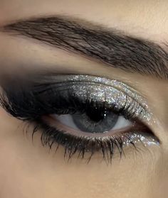 Black Eyeshadow Looks With Glitter, Siren Eyes Eyeshadow, Smokey Eyeliner With Glitter, Smokey Eye Makeup For Blue Green Eyes, Grey And Silver Eyeshadow, Black And Silver Makeup Ideas, Silver Glitter Eyeliner Looks, Black Sparkly Eyeshadow, Star Glitter Eye Makeup