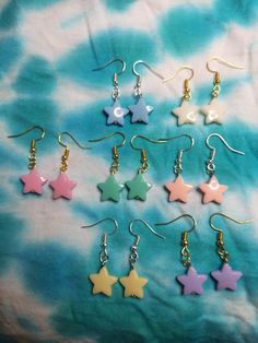 Pastel star earrings.  Available in 7 colours. Available in gold or silver earring hooks.  Listing is for one pair Multicolor Star Earrings, Cute Dangle Earrings With Star Charm, Cute Star Charm Dangle Earrings, Pink Star Charm Dangle Earrings, Pink Dangle Earrings With Star Charm, White Star-shaped Earrings With Star Charm, Trendy Star-shaped Earrings For Gifts, Trendy Star-shaped Earrings As A Gift, White Star-shaped Nickel-free Earrings