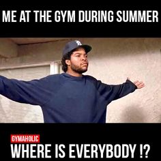 a man in a baseball cap and sweatshirt with his arms spread out, saying me at the gym during summer where is everybody?