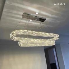 a chandelier hanging from the ceiling in a room