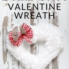 dollar store valentine wreath with red and white plaid bow hanging from it's center