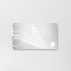 a white gift card sitting on top of a table