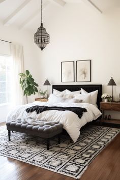 a large bed sitting on top of a wooden floor