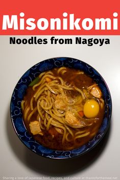 a blue bowl filled with noodles and an egg sitting on top of the book cover