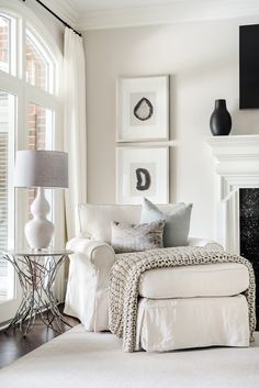 a living room filled with furniture and a fire place