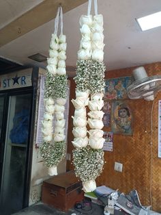 flowers hanging from the ceiling in a room