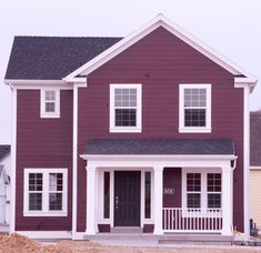 a purple house with white trim and windows