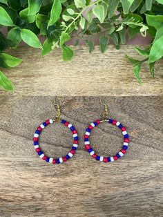 If you're a Buffalo Bills fan, you are going to love these! Add a special piece of jewelry to your outfit, and show your love for the Buffalo Bills! Blue, Red & White Buffalo Bills beaded hoop earrings are made out of gold-plated wired hoops strung with blue, red, and white beads to create a beautiful look that compliment any Buffalo Bills Mafia outfit! Gold earring hooks are nickel free, and hypoallergenic, so anyone can wear them! The earrings also include a silicone back to be sure your earrings stay on your ear! *Earring Diameter: 1.4 inches *Earring Drop Length: 2.6 inches *These earrings make perfect Buffalo Bills lovers gifts! They're simple, yet stand out in the stands!  *Dip the hook into hydrogen peroxide for about 30 seconds to clean the hooks. DO NOT dip the entire earring (hoo Buffalo Bills Beaded Earrings, Buffalo Bills Bracelet, Blue Patriotic Beaded Earrings As Gift, White Buffalo Earrings, Buffalo Bills Gear, Patriotic Jewelry, Ear Earrings, White Buffalo, Buffalo Bills